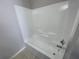 Tub and shower combo with white tile and chrome fixtures at 514 Wilton Cir, Sanford, FL 32773