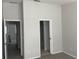 Bedroom with soft carpet flooring, neutral paint, and access to the ensuite bathroom at 514 Wilton Cir, Sanford, FL 32773