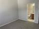View of bedroom with wall-to-wall carpeting and adjoining bathroom at 514 Wilton Cir, Sanford, FL 32773