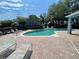 Sparkling community pool with lounge chairs and brick surround for relaxing lakeside living at Placid Lake at 514 Wilton Cir, Sanford, FL 32773