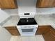 Close up of modern stove, cabinetry, and countertops in the kitchen at 514 Wilton Cir, Sanford, FL 32773