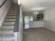 Open-concept living room featuring neutral paint, carpeted floors and natural light at 514 Wilton Cir, Sanford, FL 32773