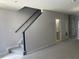 Staircase with neutral carpet and gray trim connecting the different levels of the home at 514 Wilton Cir, Sanford, FL 32773