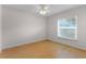 Bedroom featuring light wood floors, a ceiling fan and window at 520 Farmingham Ct, Oviedo, FL 32765