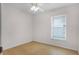 Bedroom featuring light wood floors, a ceiling fan and window at 520 Farmingham Ct, Oviedo, FL 32765