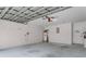 Spacious garage featuring ample room for parking and storage, with visible mechanical systems and a utility door at 520 Farmingham Ct, Oviedo, FL 32765