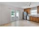 Kitchen featuring stainless steel appliances, wooden cabinets, and a view of the outdoor patio at 520 Farmingham Ct, Oviedo, FL 32765