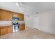Well-lit kitchen with wood cabinets, stainless steel appliances, and plenty of counter space at 520 Farmingham Ct, Oviedo, FL 32765