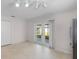 Bright eat-in kitchen with modern lighting, tile floors, and access to the outdoor patio at 520 Farmingham Ct, Oviedo, FL 32765