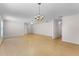Open living space with hardwood floors, ceiling fan, and a chandelier, ideal for entertaining at 520 Farmingham Ct, Oviedo, FL 32765
