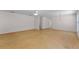 Large living area with hardwood floors and neutral walls, offering ample space for furniture at 520 Farmingham Ct, Oviedo, FL 32765