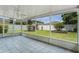 Screened patio with tiled flooring overlooking the fenced in backyard at 520 Farmingham Ct, Oviedo, FL 32765