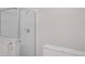 Close up of frameless shower with marble trim at 520 Farmingham Ct, Oviedo, FL 32765