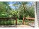 This home has a wooden back deck with a wooded view, perfect for relaxing or entertaining at 609 Northbridge Dr, Altamonte Springs, FL 32714