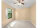 Bedroom featuring a ceiling fan and a large window for natural light at 609 Northbridge Dr, Altamonte Springs, FL 32714