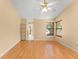 Bright main bedroom with ceiling fan, wood floors, and an en-suite bathroom with dual sinks and plenty of storage at 609 Northbridge Dr, Altamonte Springs, FL 32714