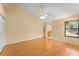Bright bedroom features wood floors, a ceiling fan, and a large window at 609 Northbridge Dr, Altamonte Springs, FL 32714