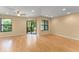 Sun-filled living room with wood floors, recessed lighting, ceiling fan, and large windows offering scenic views at 609 Northbridge Dr, Altamonte Springs, FL 32714