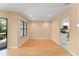 Open living room with wood floors, recessed lighting, and a large window overlooking a deck and the backyard at 609 Northbridge Dr, Altamonte Springs, FL 32714