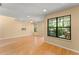 Spacious living room with wood floors, ceiling fan, recessed lighting, and large windows overlooking a deck and the backyard at 609 Northbridge Dr, Altamonte Springs, FL 32714