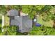 Aerial view showcasing the house's roof, backyard, and surrounding greenery at 641 E Livingston St, Orlando, FL 32803