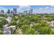 A captivating aerial view showcasing lush trees and the downtown skyline at 641 E Livingston St, Orlando, FL 32803