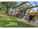 Backyard featuring a pergola-covered fire pit and an outdoor dining space for entertaining at 641 E Livingston St, Orlando, FL 32803
