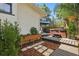 Charming backyard featuring raised garden beds, a hot tub, and a covered patio with comfortable seating at 641 E Livingston St, Orlando, FL 32803