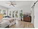 Bright bedroom with backyard views and a stylish dresser at 641 E Livingston St, Orlando, FL 32803