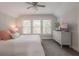 Bright bedroom with neutral walls, a ceiling fan, and three windows letting in natural light at 641 E Livingston St, Orlando, FL 32803