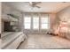 Bright bedroom with a bunk bed, rocking chair, and natural light from the large window at 641 E Livingston St, Orlando, FL 32803