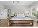 Serene bedroom with a wood-framed bed and neutral decor at 641 E Livingston St, Orlando, FL 32803