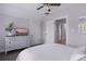 Bedroom featuring a ceiling fan, and a white dresser with a television and decorative plant at 641 E Livingston St, Orlando, FL 32803