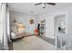 Cozy bedroom with a rocking chair, plush rug, and decorative wall hangings at 641 E Livingston St, Orlando, FL 32803