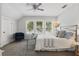 Bedroom featuring a bed, large windows, and neutral carpet at 641 E Livingston St, Orlando, FL 32803