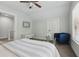 Bedroom featuring a bed, an accent chair, and neutral carpet at 641 E Livingston St, Orlando, FL 32803