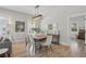 Bright dining area with modern light fixture and wood-look floors at 641 E Livingston St, Orlando, FL 32803