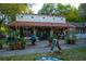 Exterior of Eola General with outdoor seating and lush potted plants at 641 E Livingston St, Orlando, FL 32803