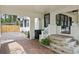 Charming walkway with a step-up entry porch on a vintage-style home with black window trim at 641 E Livingston St, Orlando, FL 32803