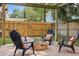 Relax by the stone fire pit, surrounded by Adirondack chairs, on the backyard brick patio at 641 E Livingston St, Orlando, FL 32803