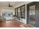 Covered front porch with brick flooring, chairs, and an inviting 'Welcome' mat at 641 E Livingston St, Orlando, FL 32803