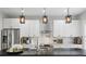 Modern kitchen with stainless steel appliances and stylish lighting at 641 E Livingston St, Orlando, FL 32803