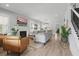 Bright living room with a fireplace, hardwood floors, and an open floor plan at 641 E Livingston St, Orlando, FL 32803