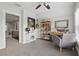 Bright office featuring a ceiling fan, large window, desk, and built-in bookshelves at 641 E Livingston St, Orlando, FL 32803