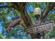 Historic Lake Eola Heights district sign surrounded by a large tree and American flag at 641 E Livingston St, Orlando, FL 32803