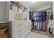 Walk-in closet featuring custom shelving, drawers, and ample storage for an organized wardrobe at 641 E Livingston St, Orlando, FL 32803