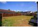 Fenced backyard with grass, ideal for outdoor activities at 6856 Ebans Bend, Orlando, FL 32807