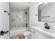 Modern bathroom with tiled shower/tub and vanity at 6856 Ebans Bend, Orlando, FL 32807