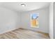 Bedroom featuring LVP flooring and natural light from a single window at 6856 Ebans Bend, Orlando, FL 32807