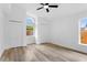 Empty bedroom with luxury vinyl flooring, two closets, and natural light at 6856 Ebans Bend, Orlando, FL 32807